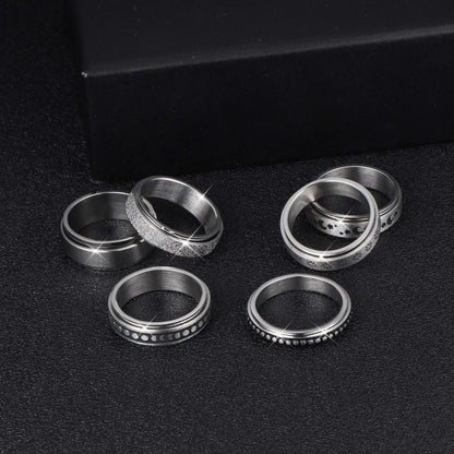 Rotatable stainless steel spinner ring with moon and star designs for anxiety relief and style