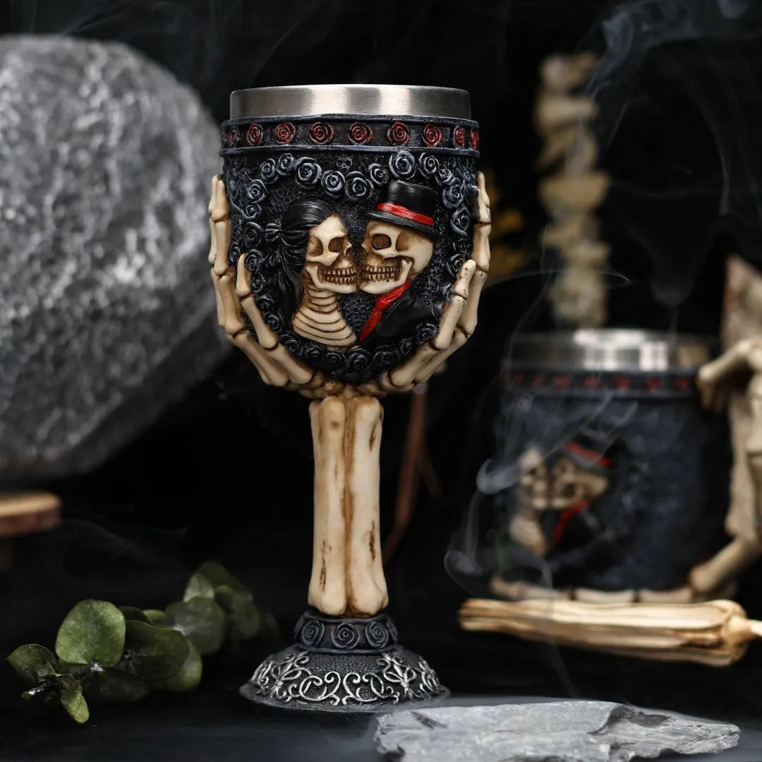 Red wine glass with stainless steel stem and detailed resin couple skeleton decoration, 200ml capacity
