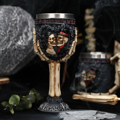 Red wine glass with stainless steel stem and detailed resin couple skeleton decoration, 200ml capacity