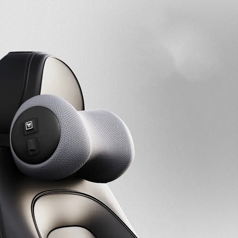 Black car massage cushion with headrest and lumbar support on a car seat, showing wired controller.