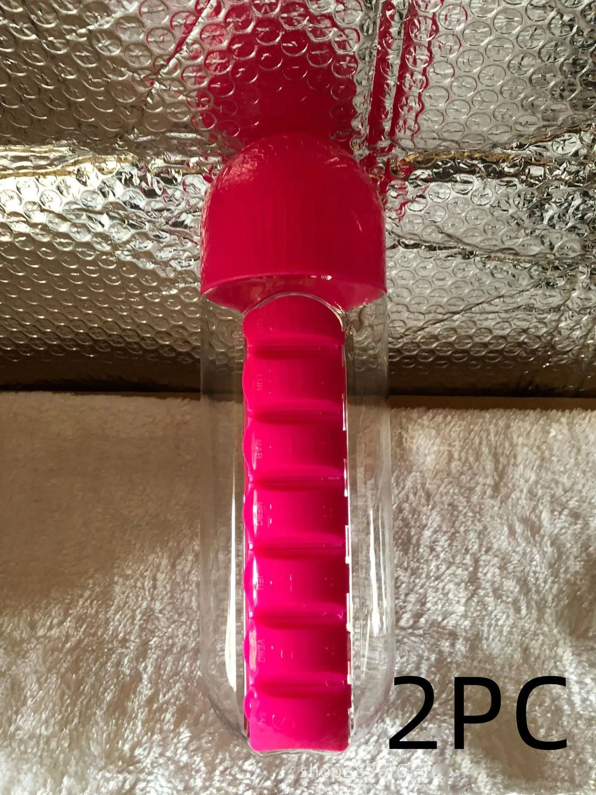 Water bottle with seven pill compartments attached, showing 600ml capacity and BPA-free construction