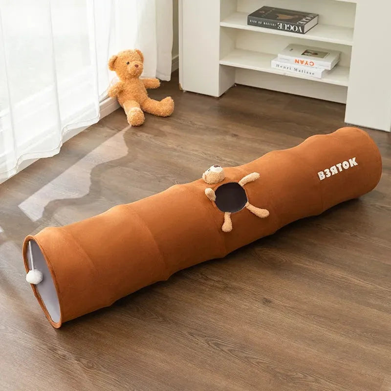 Collapsible cat tunnel in grey with attached plush ball, showing folded and extended positions