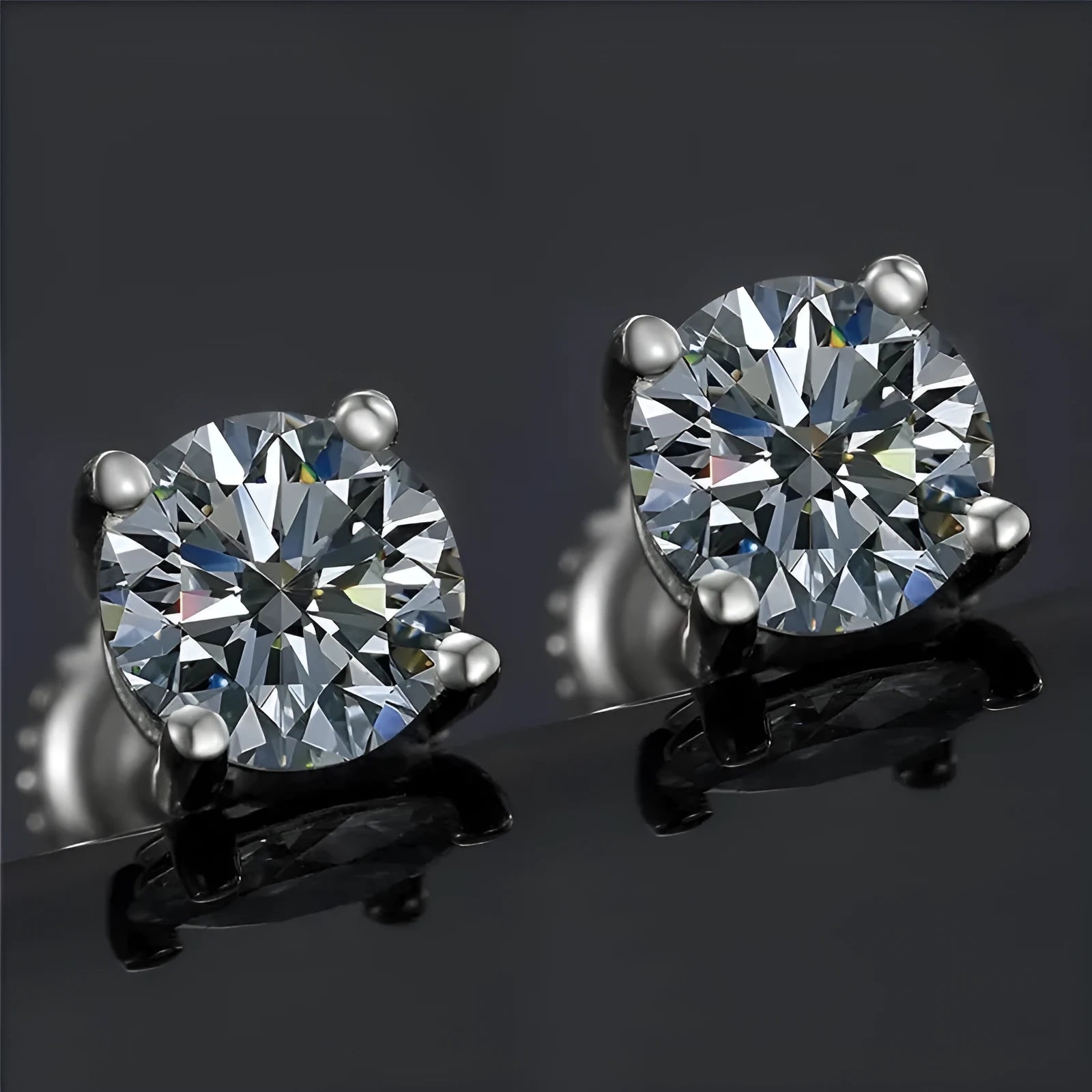 Silver four claw screw back moissanite stud earrings with geometric stone on a 7mm wide setting.
