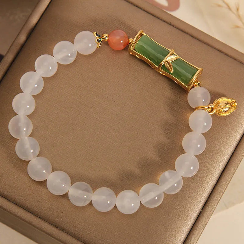 Women's white agate and jade bamboo bead bracelet in retro Chinese style.