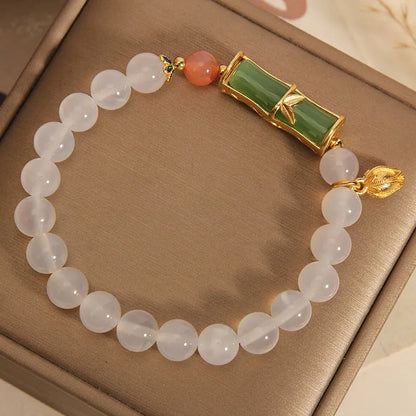 Women's white agate and jade bamboo bead bracelet in retro Chinese style.