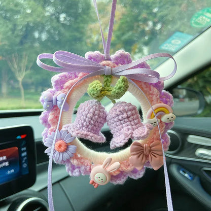Green woven wool bell orchid car pendant hanging, showing handmade texture and fresh style.