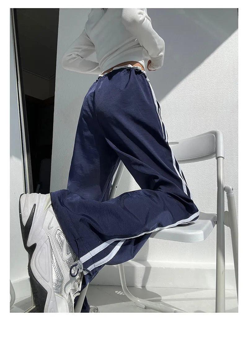 Women's navy blue straight-leg trousers with white contrast ribbon parallel bars pattern design