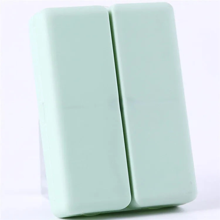 Blue foldable pill box with seven compartments and magnetic closure showing open and closed positions