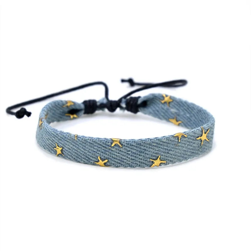 National style denim fabric bracelet carrying strap showing mixed material construction and wristband design