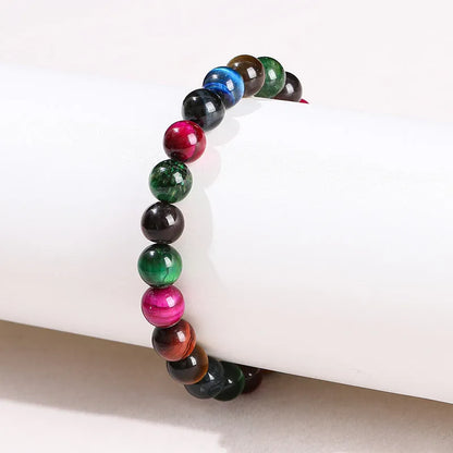 Colourful tiger-eye gemstone bracelet with round beads in 6mm, 8mm, 10mm, and 12mm sizes on mixed string