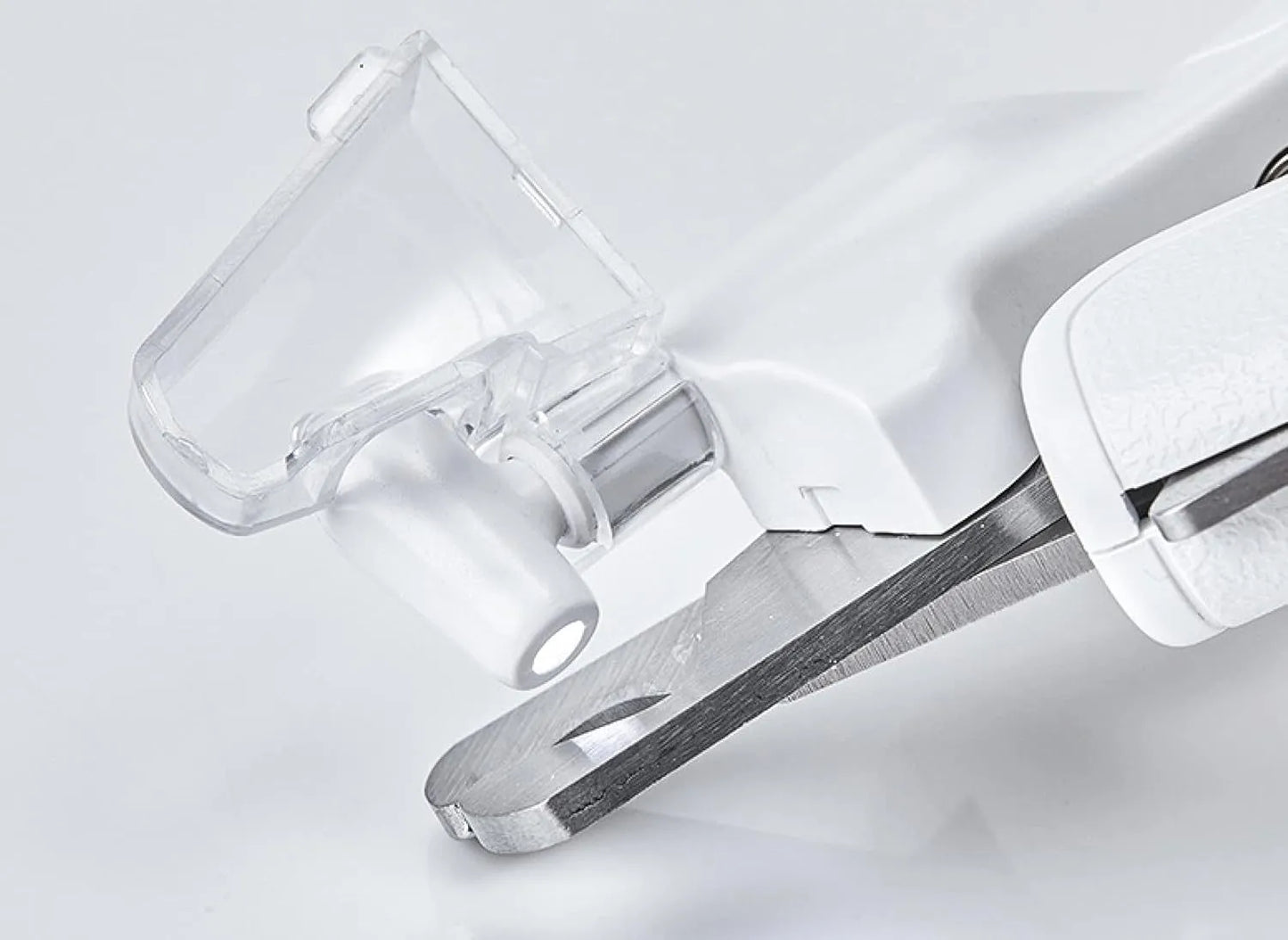 White LED pet nail clippers with a transparent safety guard and a nail file on a grey background.