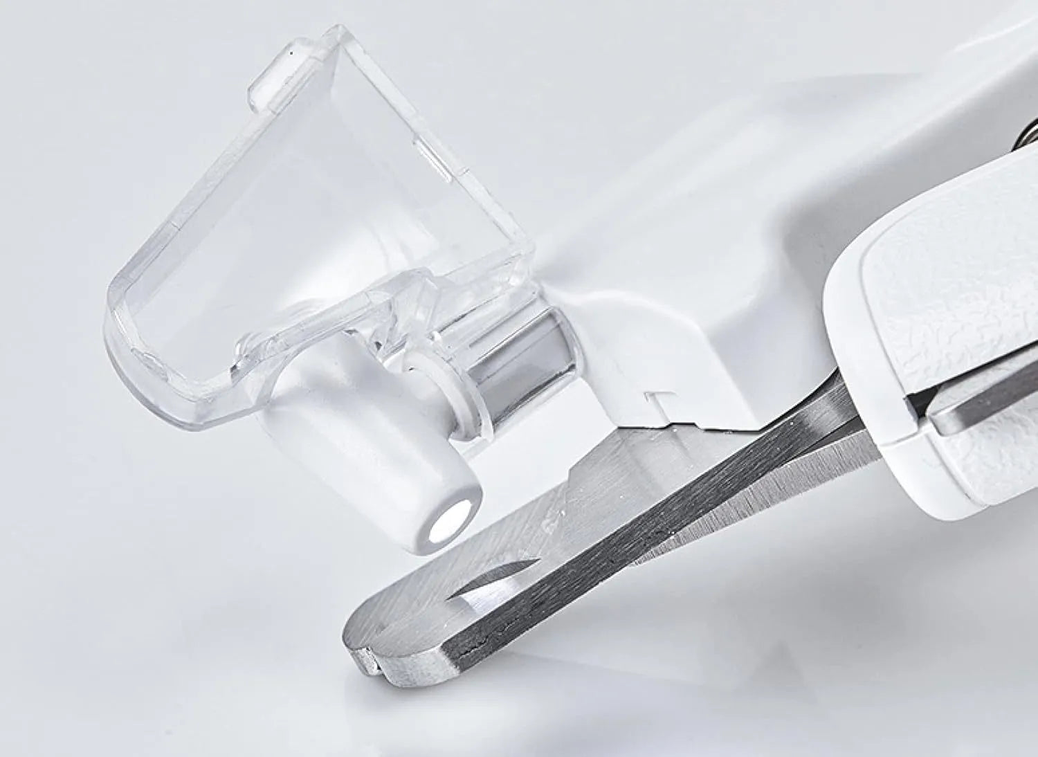 White LED pet nail clippers with a transparent safety guard and a nail file on a grey background.