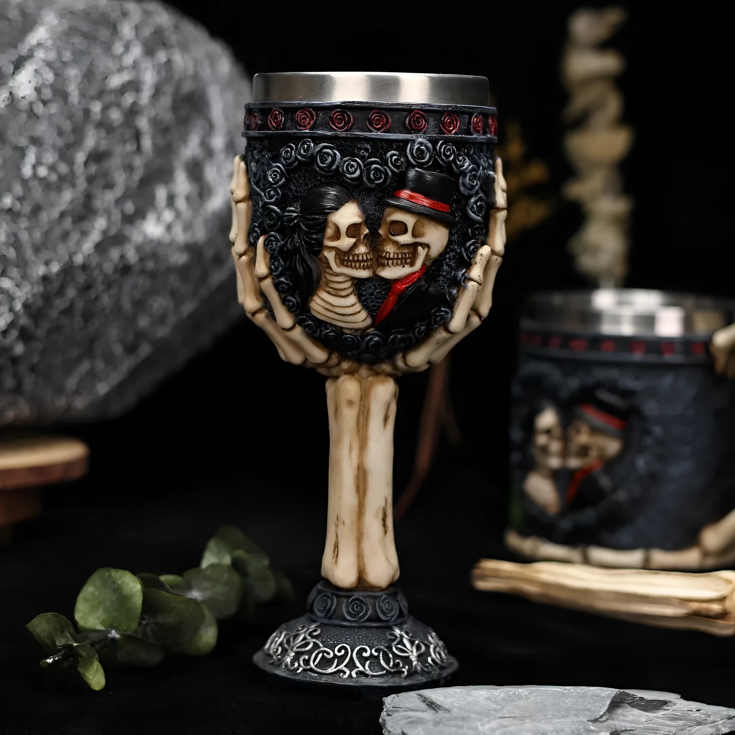 Red wine glass with stainless steel stem and detailed resin couple skeleton decoration, 200ml capacity