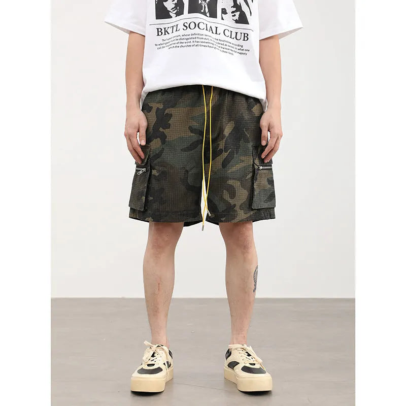 Men's camouflage coloured cargo shorts with multiple pockets and cropped leg length