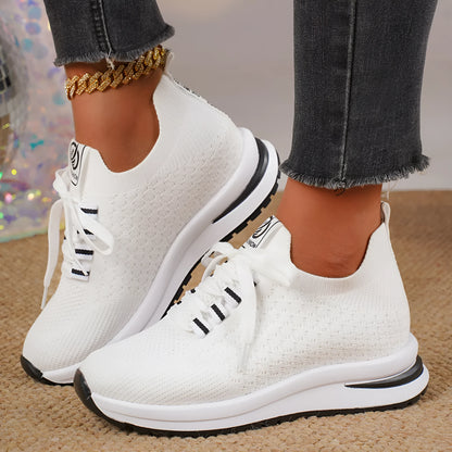 Women's flat lace-up mesh sneakers in black and white colours with round toe