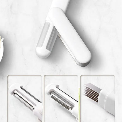White multifunctional rotary kitchen peeler with stainless steel blade and ergonomic PP handle.