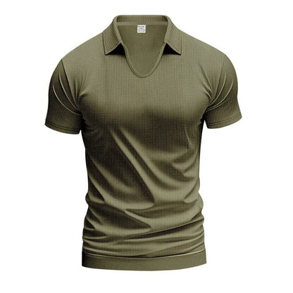 Man modelling a loose-fit apricot coloured V-neck short-sleeve T-shirt for casual summer wear.