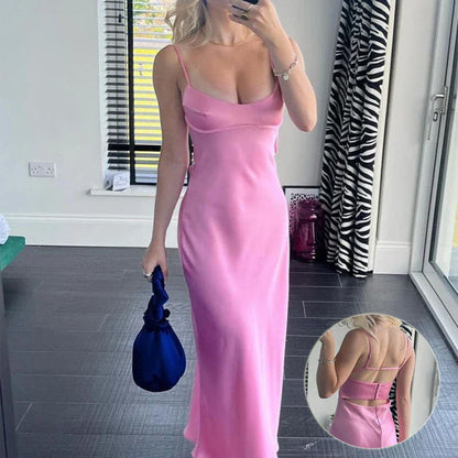 Elegant satin slip dress in pink with a square neckline, sleeveless design, and backless detail
