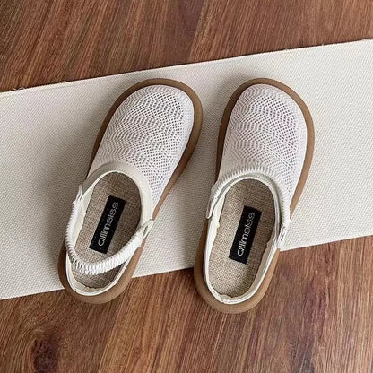 Breathable linen slip-on hole shoes in milky white colour with mesh lining and rubber sole.