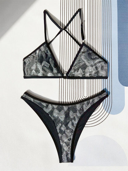 Black two-piece ladies bikini swimsuit with adjustable straps, shown on a model.