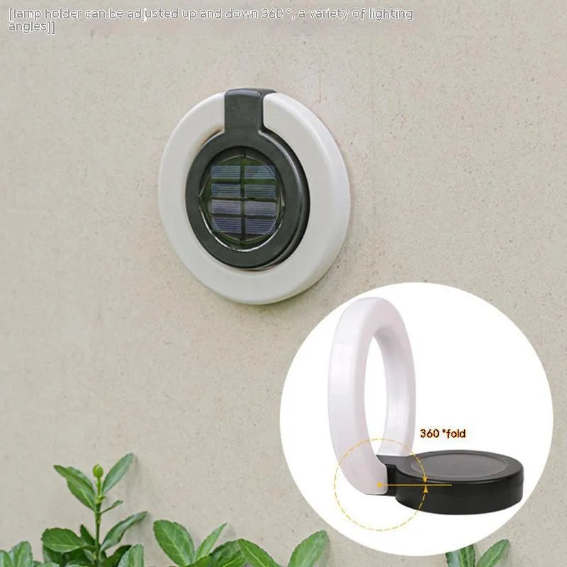 Solar-powered waterproof underground garden light showing its low-profile design and solar panel.