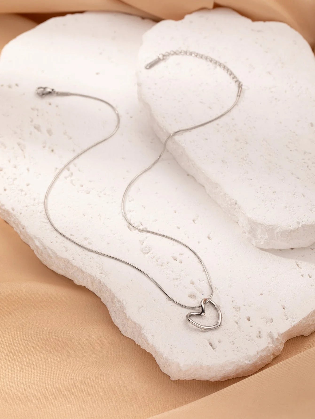 Elegant titanium steel heart pendant necklace with adjustable chain in gold and silver colors