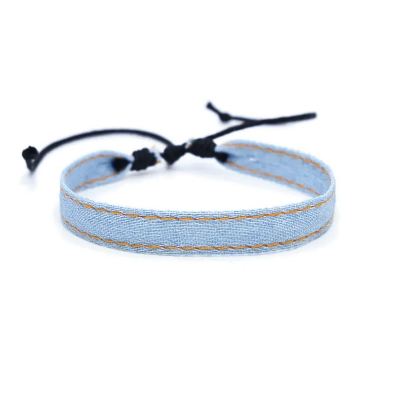 National style denim fabric bracelet carrying strap showing mixed material construction and wristband design