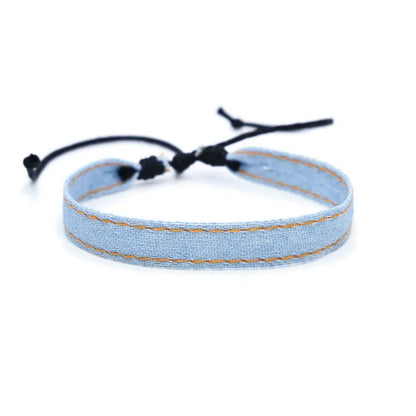 National style denim fabric bracelet carrying strap showing mixed material construction and wristband design