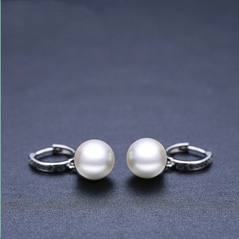 Stylish black round ball stud earrings for women, minimalist design, durable copper construction.
