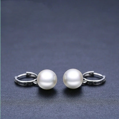 Stylish black round ball stud earrings for women, minimalist design, durable copper construction.