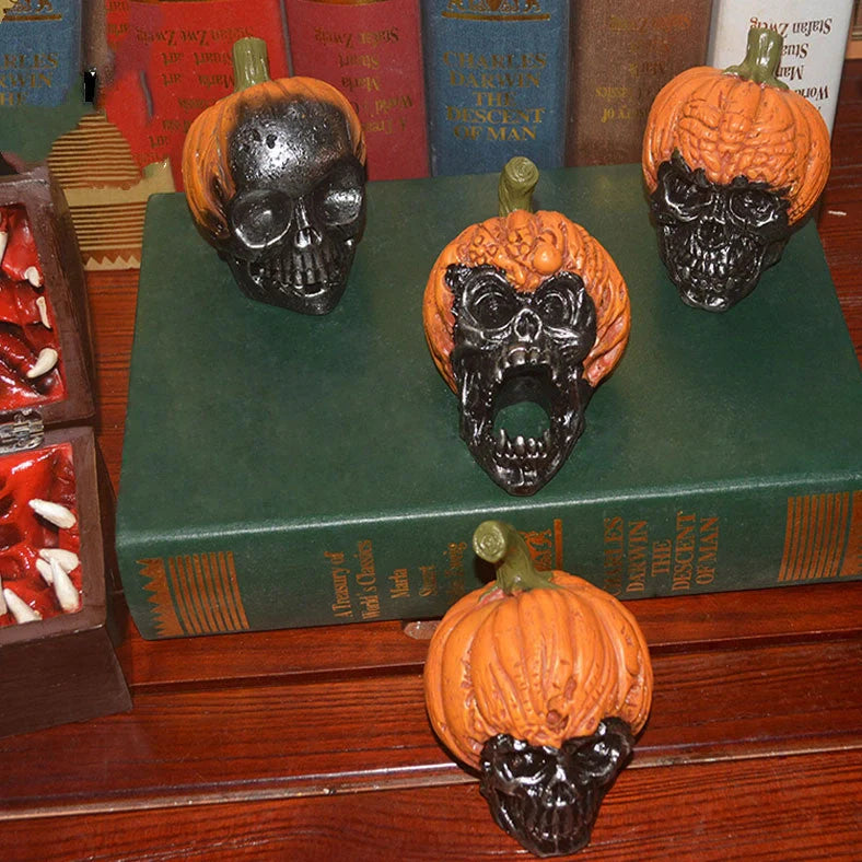 Hand-painted pumpkin skull resin ornament measuring 12cm tall with orange and black colour scheme