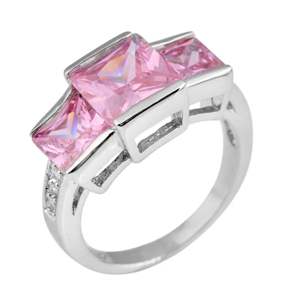 Aier Moxa geometric copper fashion ring in assorted electroplated colours on a plain background.