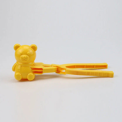 Red heart-shaped snowball maker clip for kids, perfect for winter play