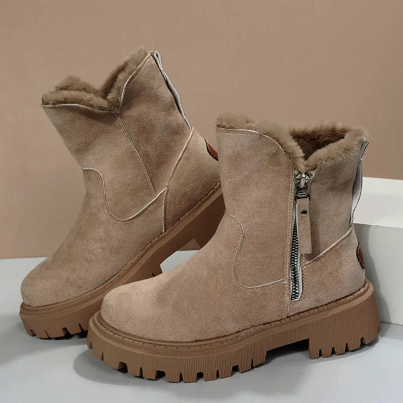 Women's black faux suede high-top snow boots with a side zipper and fur-lined collar.