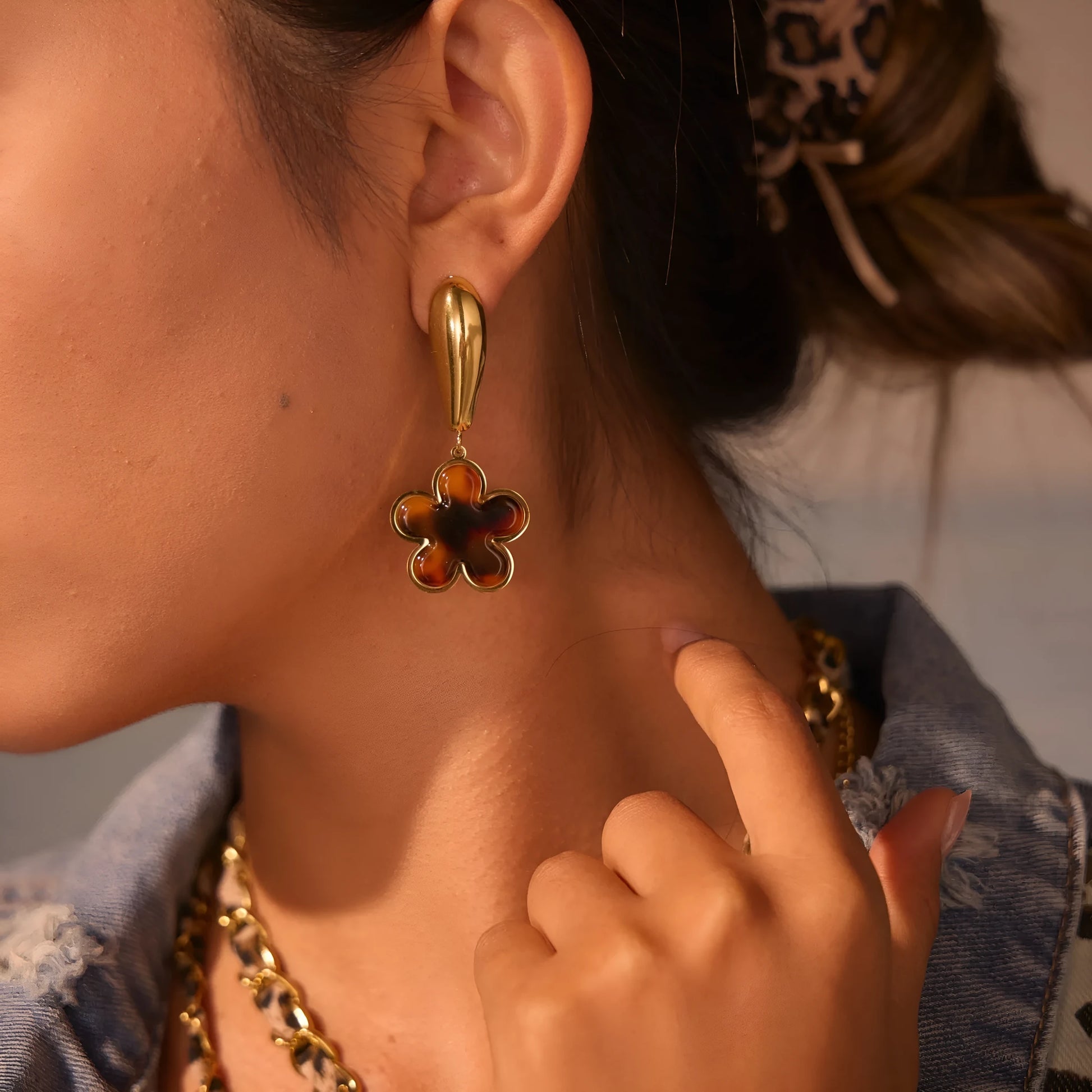 Women's tortoiseshell resin style earrings with 18K gold electroplated finish on stainless steel, heart and floral designs