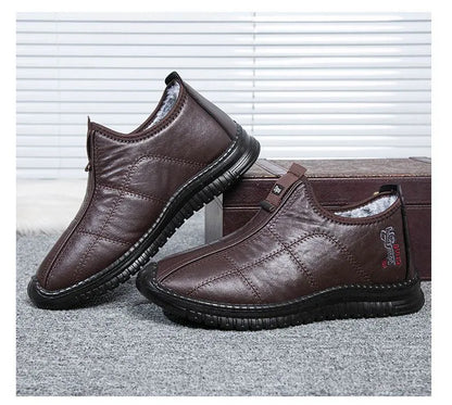 Men's brown casual winter boots with a round toe, buckle closure, and a low-top cotton upper.