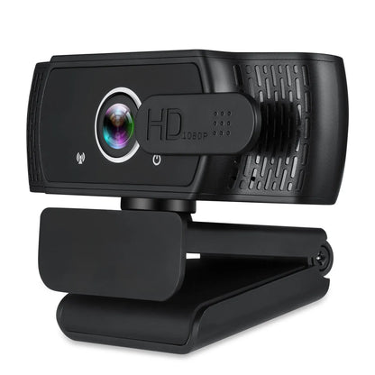 Black USB webcam with microphone on a laptop screen, showing 360-degree rotation and universal clip.