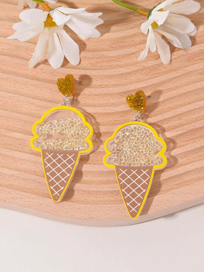 A pair of colourful acrylic earrings shaped like a strawberry and a cherry on a woman's ear.