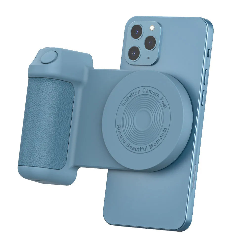 Black magnetic phone camera grip with rotatable bracket and ergonomic PU leather handle on a table.