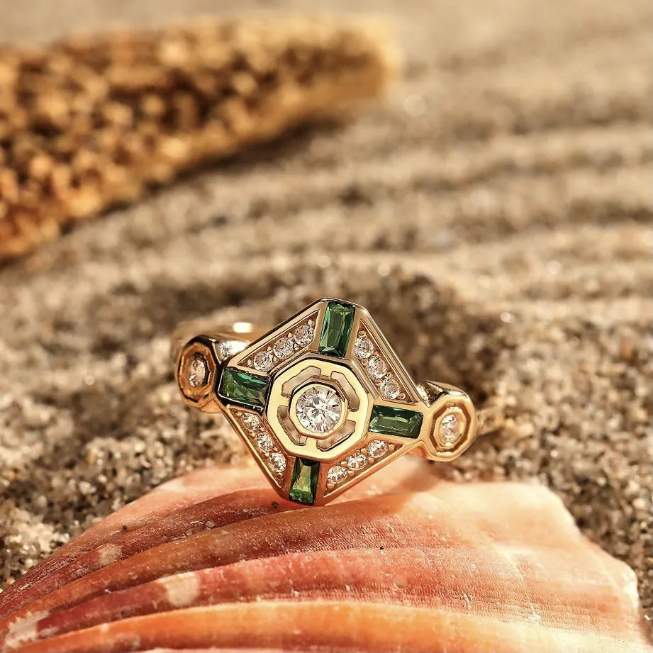 Square geometric gemstone ring with electroplated finish in lvzuan colour, shown on a model's hand.