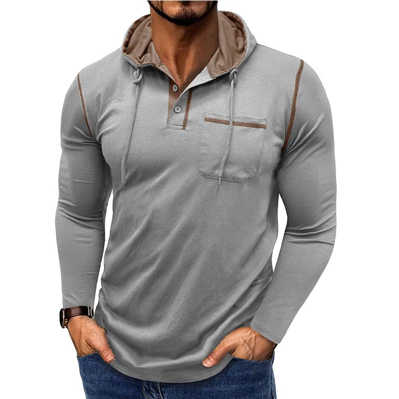 Man wearing a grey hooded henley long-sleeved t-shirt, showcasing the pullover style and cotton blend fabric.