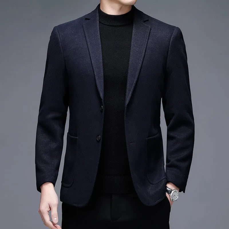 Man wearing a solid colour loose-fit suit-style winter jacket.