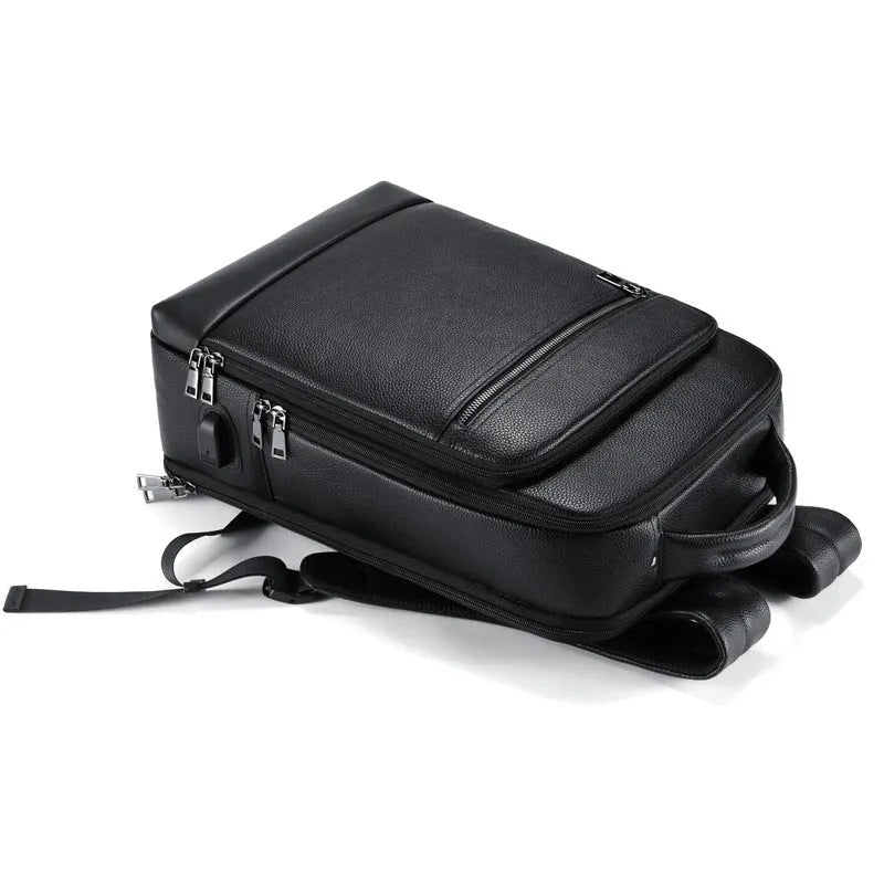 Leather men's business computer backpack for office commuting under 20L capacity with curved shoulder strap system and solid black colour for professional travel