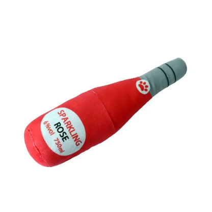 Soft green plush wine bottle pet toy for cats and dogs on a white background.