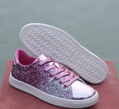 Women's low-top casual shoes with black sequin upper, round toe, and white rubber sole with lace-up closure.