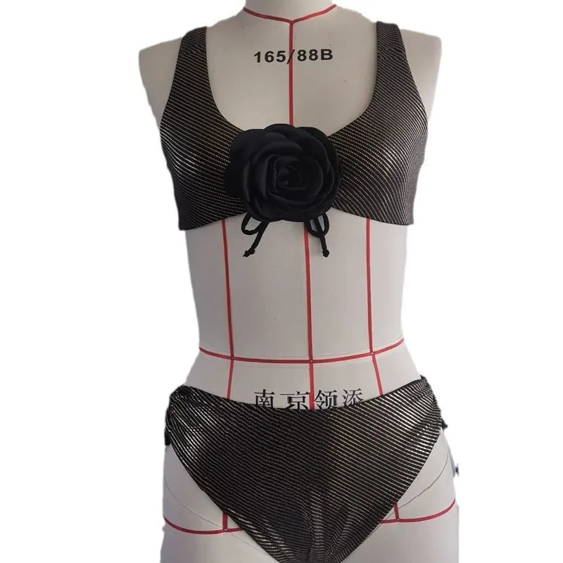 Black women's triangle swimsuit set with 3D stereo beach styling on hanger