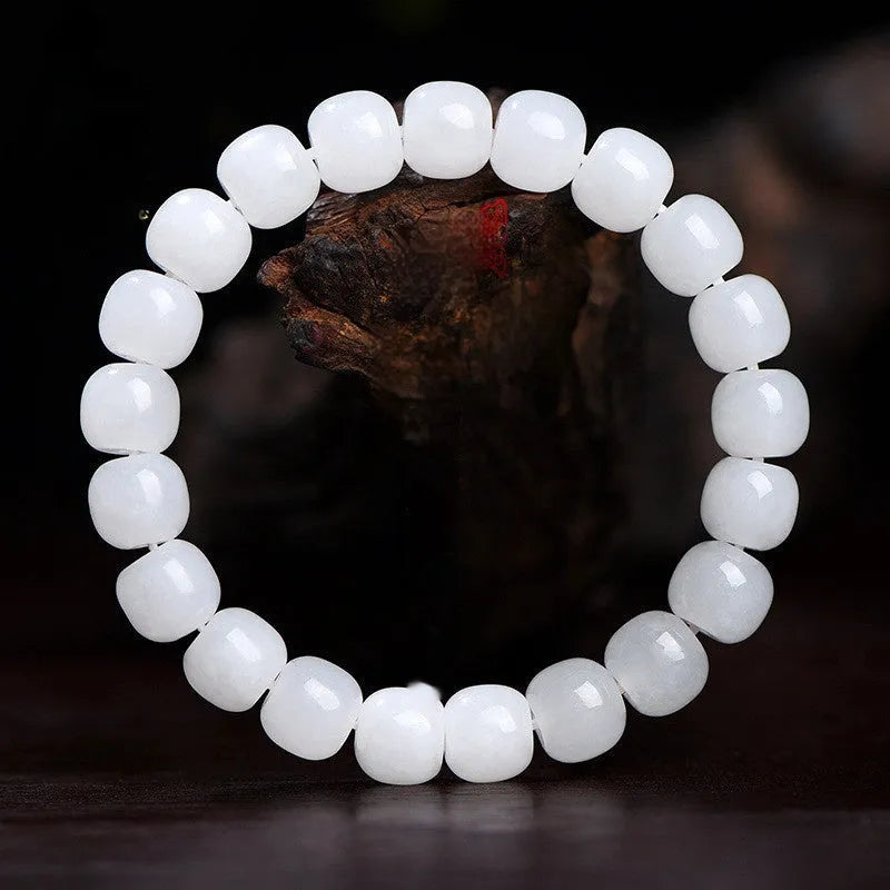 White jade barrel beads bracelet with Hetian jade beads in 5x6mm, 7x8mm, or 8x10mm sizes on a wrist