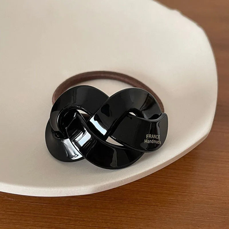 Seamless acetate hair rope ring in black, plaid, caramel, and dark coffee colours.