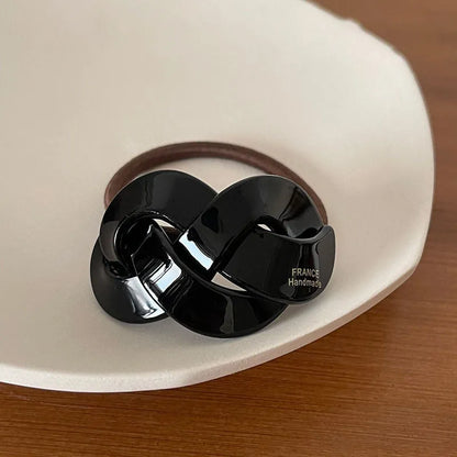 Seamless acetate hair rope ring in black, plaid, caramel, and dark coffee colours.