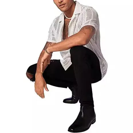 Man wearing a black short-sleeved knitted button-up shirt with a jacquard textured pattern.